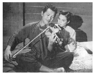 P. Ramlee with violin — from Anakku Sazali